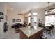 Open living room with tile floors, high ceilings, and seamless flow into the kitchen at 6966 E Bramble Berry Ln, Scottsdale, AZ 85266