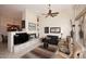 Spacious living room features a fireplace and ample seating with plenty of natural light at 6966 E Bramble Berry Ln, Scottsdale, AZ 85266