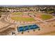 A captivating aerial view of baseball and pickleball courts with mountain views at 7144 E Lakeview Ave, Mesa, AZ 85209