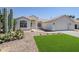 Exterior view of a well-kept home with stucco finish and tiled roof at 7144 E Lakeview Ave, Mesa, AZ 85209