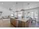 Stylish kitchen featuring a large island with seating and modern fixtures at 7144 E Lakeview Ave, Mesa, AZ 85209