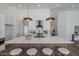 Updated kitchen featuring pendant lights, a central island, and modern finishes at 7144 E Lakeview Ave, Mesa, AZ 85209