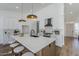 Bright kitchen with stainless steel appliances, tile backsplash, and center island at 7144 E Lakeview Ave, Mesa, AZ 85209