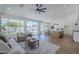 Bright and airy living room featuring large windows and an open floor plan at 7144 E Lakeview Ave, Mesa, AZ 85209