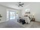 Serene main bedroom boasts pool access with abundant natural light, creating a tranquil, relaxing retreat at 7144 E Lakeview Ave, Mesa, AZ 85209