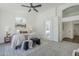 Elegant main bedroom features a comfortable king bed, soft lighting, and leads to a luxurious en-suite bathroom at 7144 E Lakeview Ave, Mesa, AZ 85209