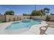 Backyard pool with surrounding deck, landscaping and privacy wall at 7144 E Lakeview Ave, Mesa, AZ 85209