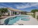Backyard swimming pool with a connected spa, set against a well-maintained home exterior at 7144 E Lakeview Ave, Mesa, AZ 85209