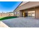 Outdoor patio and turfed backyard with travertine pavers, climbing gym, and home sauna for relaxation and recreation at 7694 W Desert Spoon Dr, Peoria, AZ 85383