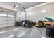 Spacious three car garage offers epoxy floors and ample room for vehicles and storage at 7694 W Desert Spoon Dr, Peoria, AZ 85383