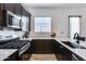 Well-equipped kitchen features stainless steel appliances, sleek countertops, and ample cabinet space for storage at 7694 W Desert Spoon Dr, Peoria, AZ 85383