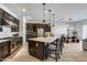 Spacious kitchen with a large center island, stainless steel appliances, and an open dining area perfect for entertaining at 7694 W Desert Spoon Dr, Peoria, AZ 85383