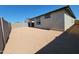 A large, flat backyard enclosed by block fencing, offering a blank canvas for landscaping and outdoor living at 8577 W Trenton Ct, Florence, AZ 85132