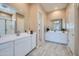 Modern bathroom with double vanities, tile flooring, and walk-in shower at 870 W Peralta Pass, Apache Junction, AZ 85120