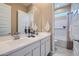 Bathroom featuring double sinks, a large mirror, and a shower and tub combination at 870 W Peralta Pass, Apache Junction, AZ 85120