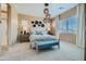 Beautifully staged bedroom with a neutral palette, decorative lighting, and comfortable seating at 870 W Peralta Pass, Apache Junction, AZ 85120
