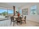 Bright dining area with table, sliding glass door leading to patio, and stylish décor at 870 W Peralta Pass, Apache Junction, AZ 85120