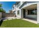 Well-maintained backyard with artificial turf, pavers, and a stucco wall, ready for outdoor enjoyment at 905 S Canal Dr # 17, Chandler, AZ 85225