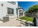 Spacious backyard with artificial turf, a block wall, pavers, and a covered patio for entertaining guests at 905 S Canal Dr # 17, Chandler, AZ 85225