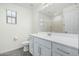 The bathroom features a window, modern vanity, and contemporary fixtures at 905 S Canal Dr # 17, Chandler, AZ 85225