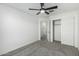 This bedroom features a closet, ceiling fan, and bright, neutral walls at 905 S Canal Dr # 17, Chandler, AZ 85225