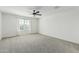 Spacious bedroom with plush carpet, ceiling fan, and window views at 905 S Canal Dr # 17, Chandler, AZ 85225