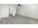 Expansive bedroom with plush carpeting, bathroom access and ceiling fan at 905 S Canal Dr # 17, Chandler, AZ 85225