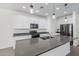 Modern kitchen with an island, stainless steel appliances, pendant lighting, and white cabinetry at 905 S Canal Dr # 17, Chandler, AZ 85225