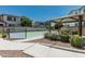 Community tennis court with shade structure and landscaping, offering a convenient recreational amenity for residents at 905 S Canal Dr # 17, Chandler, AZ 85225