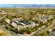 Scenic aerial view of the community with desert mountain views and lush landscaping throughout the neighborhood at 9450 N 94Th Pl # 205, Scottsdale, AZ 85258