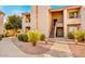 Charming apartment complex featuring well-maintained landscaping and inviting walkways to the entrances at 9450 N 94Th Pl # 205, Scottsdale, AZ 85258