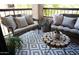 Inviting balcony with comfortable seating, potted plants, and decorative wood table at 9450 N 94Th Pl # 205, Scottsdale, AZ 85258