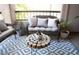 Inviting balcony with cozy seating, decorative plants, and a unique wood table at 9450 N 94Th Pl # 205, Scottsdale, AZ 85258