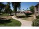 Scenic view of the walking path and tennis court with lush greenery at 9450 N 94Th Pl # 205, Scottsdale, AZ 85258