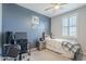 Comfortable bedroom with a single bed, desk, and stylish accents for a cozy retreat at 9752 E Torino Ave, Mesa, AZ 85212