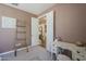Comfortable bedroom with a ladder, desk, and open doorway to another room at 9752 E Torino Ave, Mesa, AZ 85212