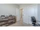 Neutral bedroom boasts carpet floors, a wood dresser and decor at 9752 E Torino Ave, Mesa, AZ 85212
