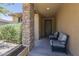 Charming front porch featuring comfortable seating, offering a welcoming entrance to the home at 9752 E Torino Ave, Mesa, AZ 85212
