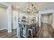 Bright, open kitchen features a center island with seating and modern lighting fixtures at 9752 E Torino Ave, Mesa, AZ 85212