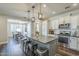 Spacious kitchen with center island, bar stool seating, and an adjacent dining area at 9752 E Torino Ave, Mesa, AZ 85212