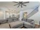 Living room showcasing an open floor plan with a large gray sectional sofa at 9752 E Torino Ave, Mesa, AZ 85212