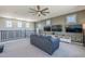Open living area with media console, comfortable seating, and ample natural light at 9752 E Torino Ave, Mesa, AZ 85212