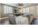 Comfortable living room with modern furniture, a ceiling fan, and a large television at 9752 E Torino Ave, Mesa, AZ 85212