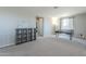 Open loft area with desk, neutral carpeting, and open layout to nearby bedrooms and living spaces at 9752 E Torino Ave, Mesa, AZ 85212