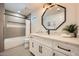 Stylish bathroom with a white vanity, modern black fixtures and a tub-shower combo at 10023 E Sunnyslope Ln, Scottsdale, AZ 85258