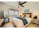 Comfortable bedroom features a window, ceiling fan and modern decor at 10023 E Sunnyslope Ln, Scottsdale, AZ 85258