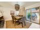 Dining area features sliding glass doors leading to a covered patio at 10023 E Sunnyslope Ln, Scottsdale, AZ 85258