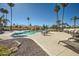 Community pool with tables and chairs for relaxing at 10023 E Sunnyslope Ln, Scottsdale, AZ 85258