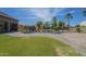 Stunning backyard oasis with large pool, lush landscaping, and a fun playset at 10033 W Jj Ranch Rd, Peoria, AZ 85383