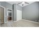 Bedroom features an attached bathroom, sliding closet doors, and ceiling fan at 10033 W Jj Ranch Rd, Peoria, AZ 85383